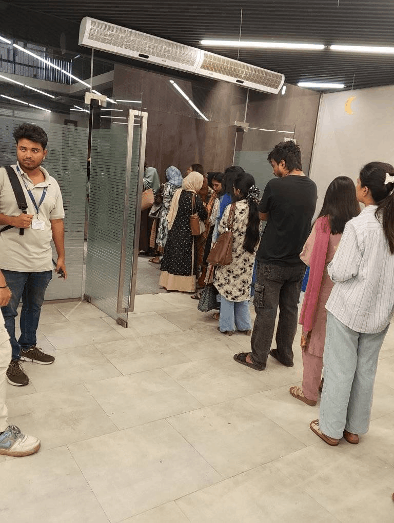 The queue keeps growing and spills all the way into the cafeteria - there is literally no space left to stand.